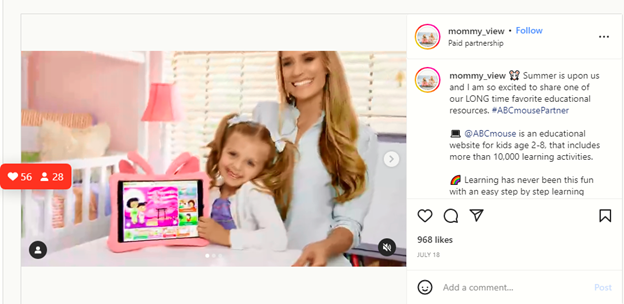 Instagram post of a mom with her daughter and her daughters pink iPad holding up an educational game