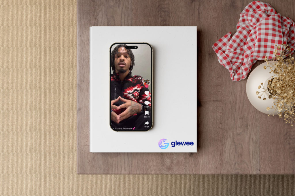 Tiktok star Keith Lee saves business with TikTok influencer marketing photographed on table in iphone on the tiktok app