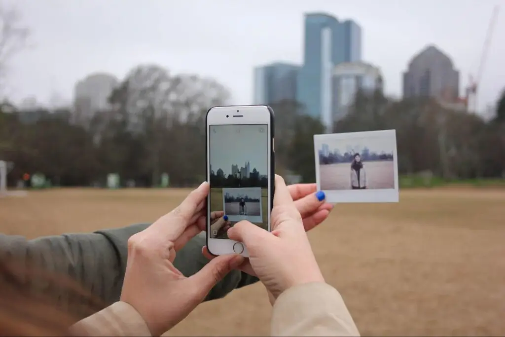 Person taking a photo of a disposable.