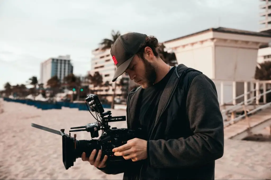 Content creator filming content outside with camera.