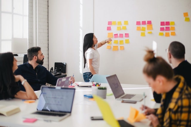 A group of marketing professionals analyzing target market vs. target audience