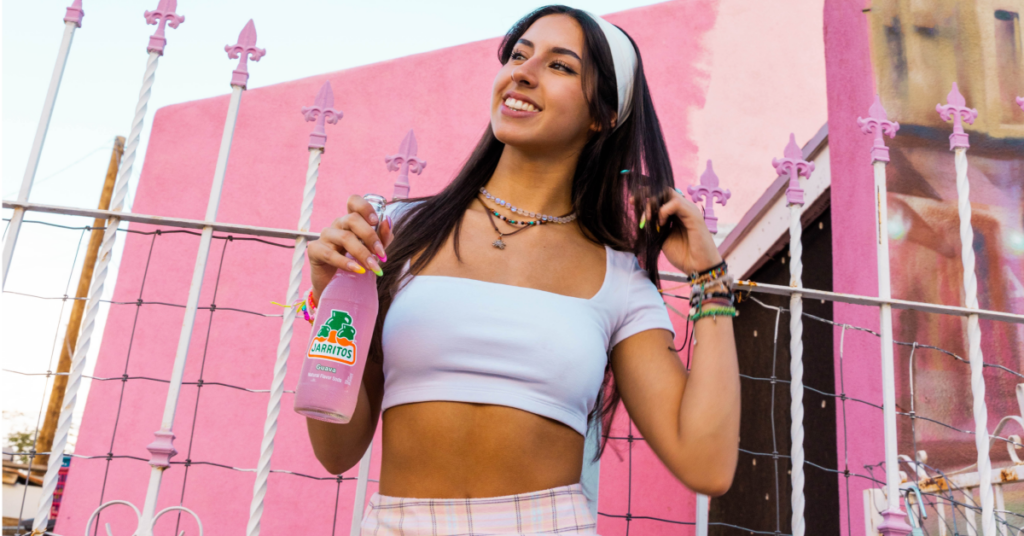 influencer holding jarritos soda for a brand collab