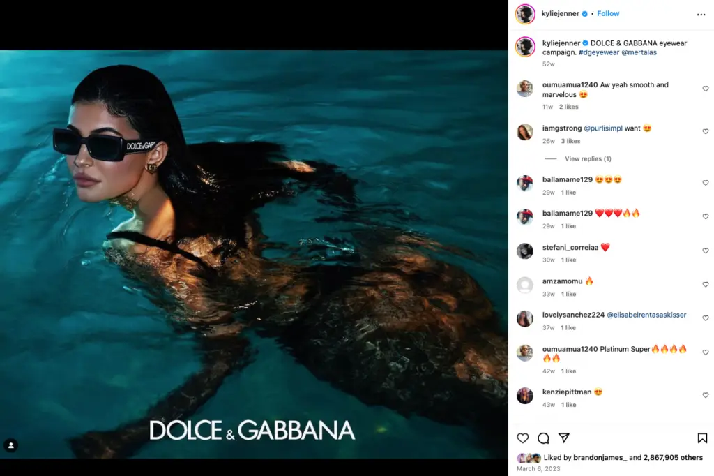 Kylie Jenner swimming in a pool wearing Dolce & Gabbana sunglasses 